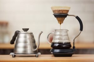coffee brewing gadgets on a wooden bar counter